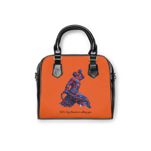 Orange handbag with black handles and a blue and red design on a white background