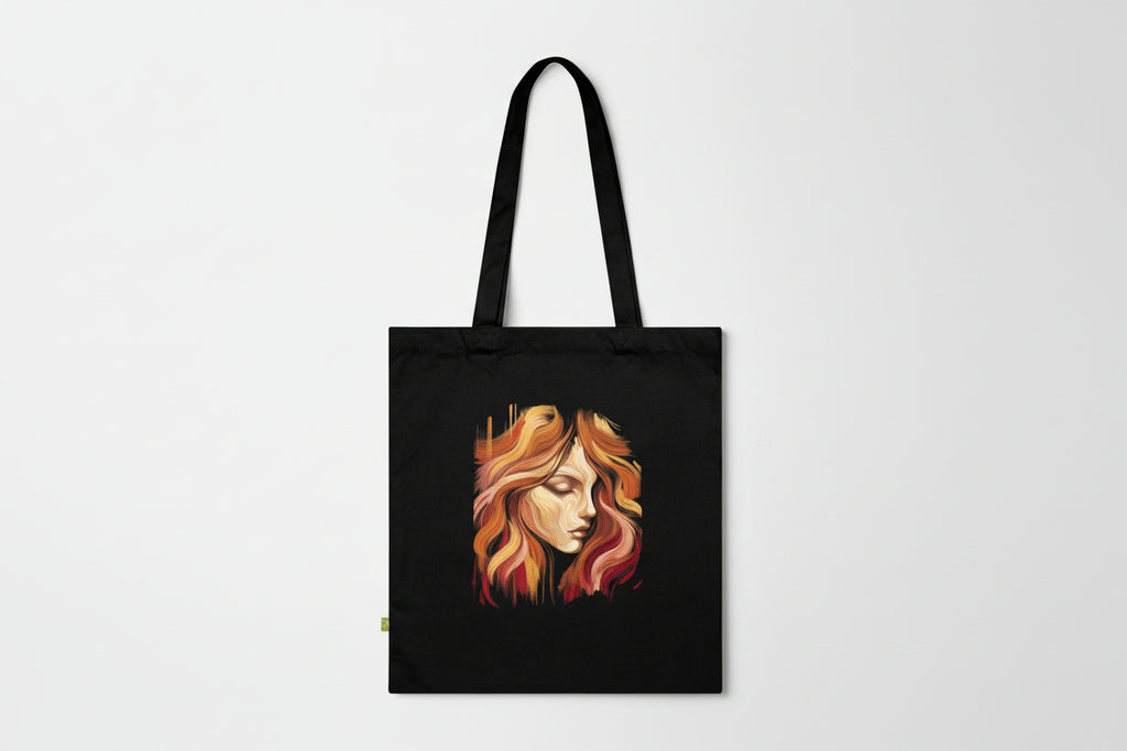 Black tote bag with a stylized face design on a white background
