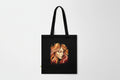 Black tote bag with a stylized face design on a white background