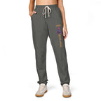 Person wearing gray sweatpants with a colorful design and text on a white background