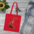 Red tote bag with '1804' design on a wooden surface with denim jacket and sunflower.
