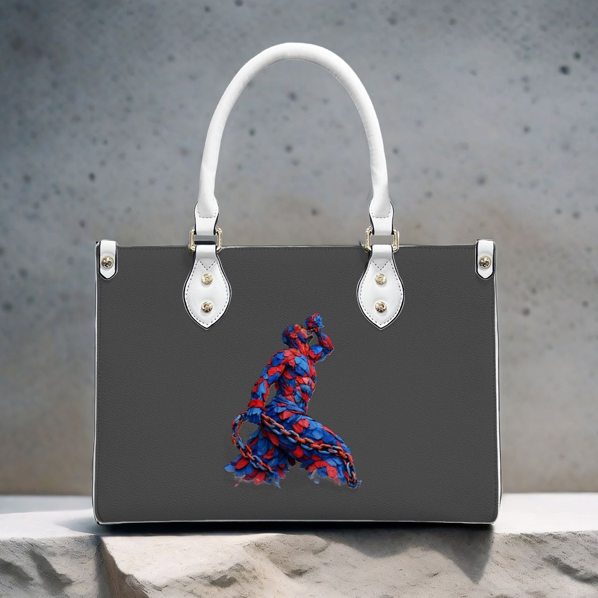 Black handbag with a colorful abstract design on a textured surface