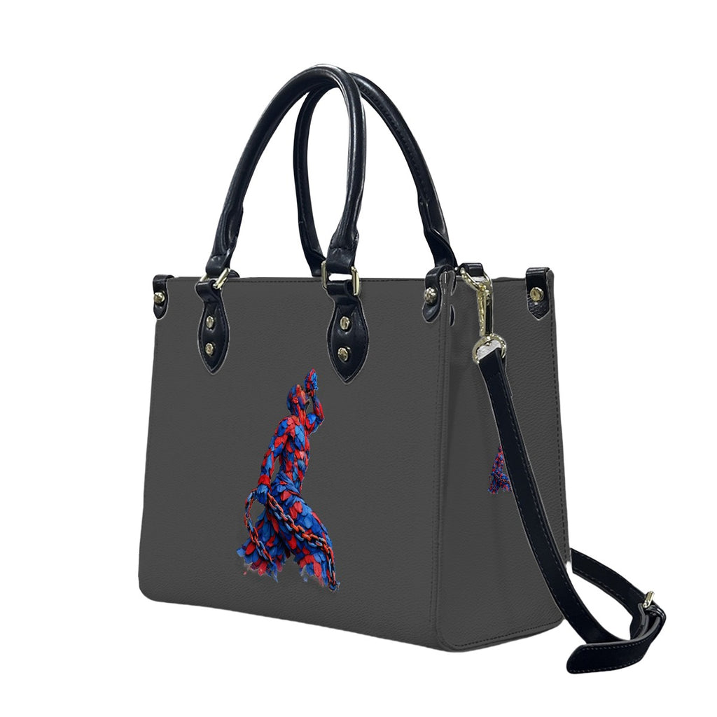 Gray handbag with black handles and strap, featuring a colorful design on a white background