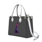 Gray handbag with a colorful tassel on a white background